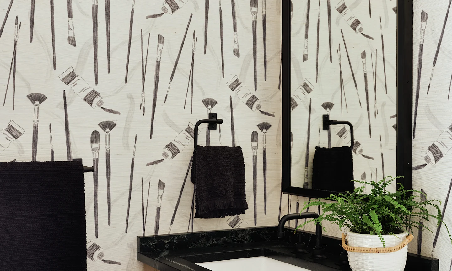 Powder room with paintbrush design grasscloth wallpaper.
