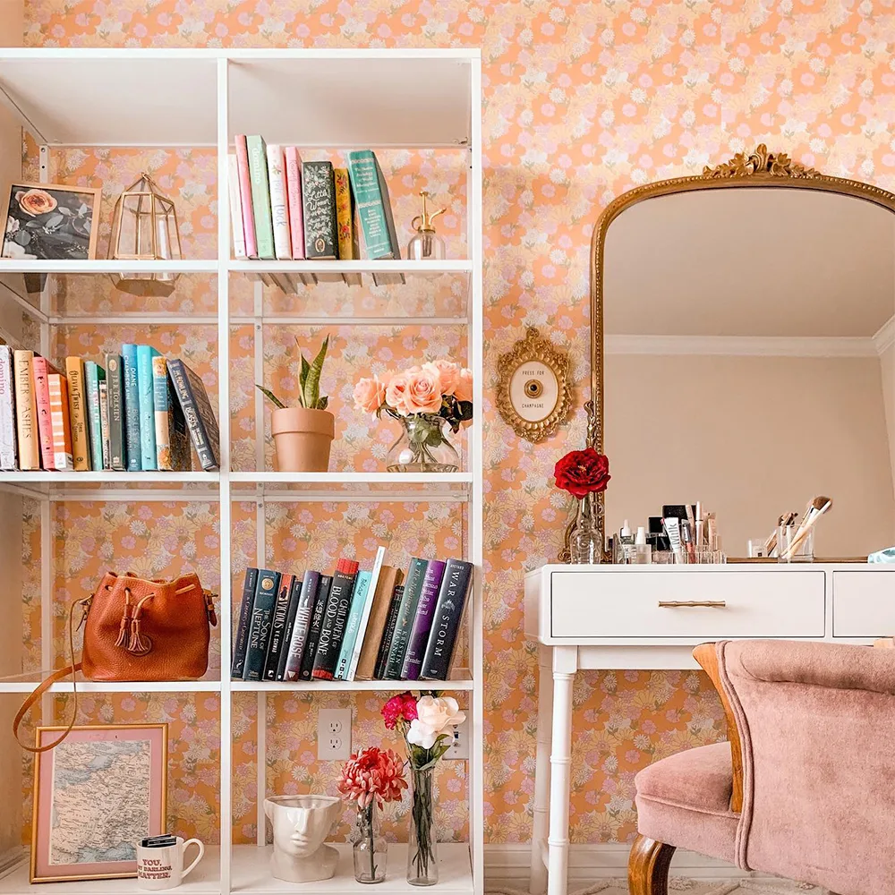 Vanity space with peach vintage floral Spoonflower wallpaper on the walls.