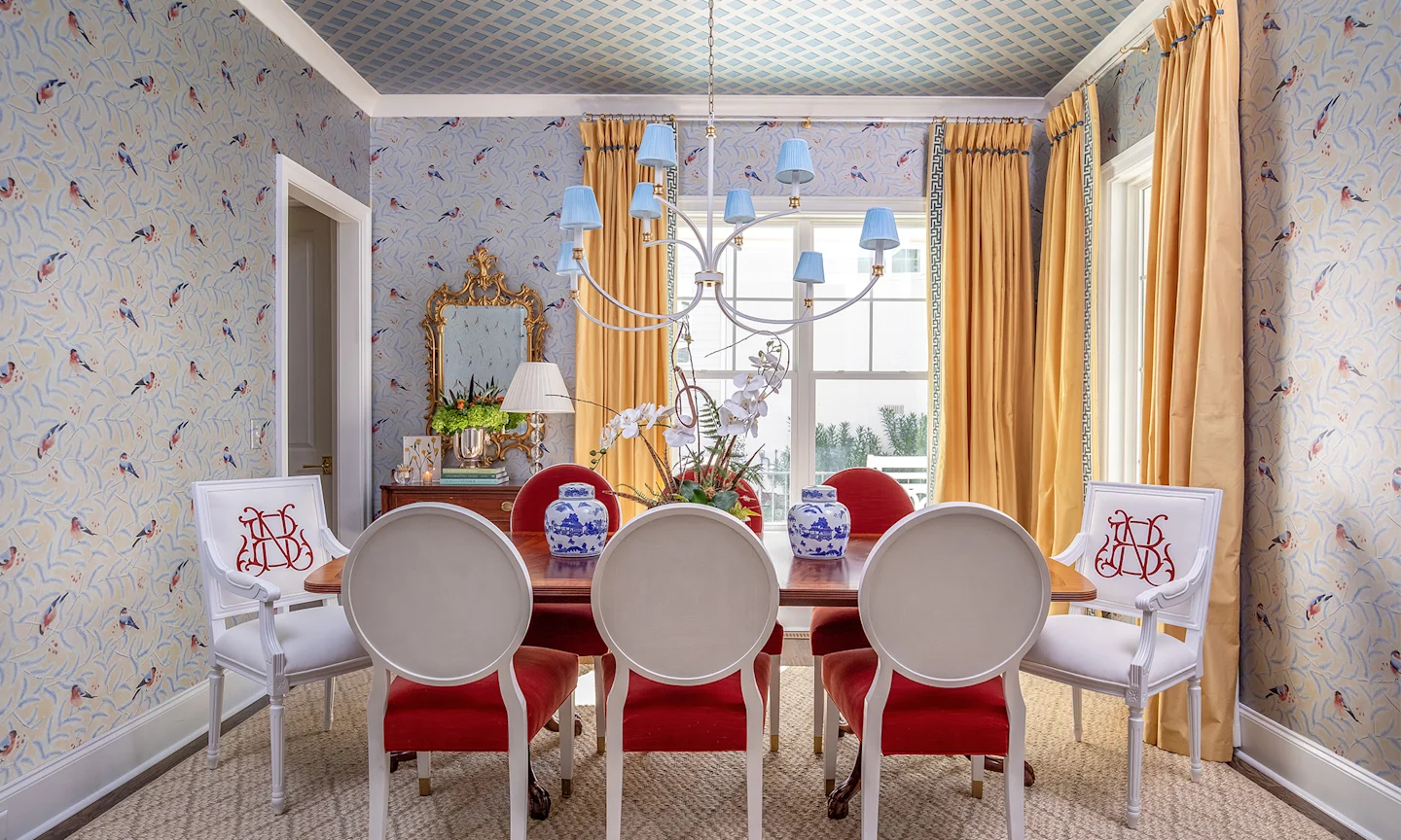 Dining room with silver metallic wallpaper.