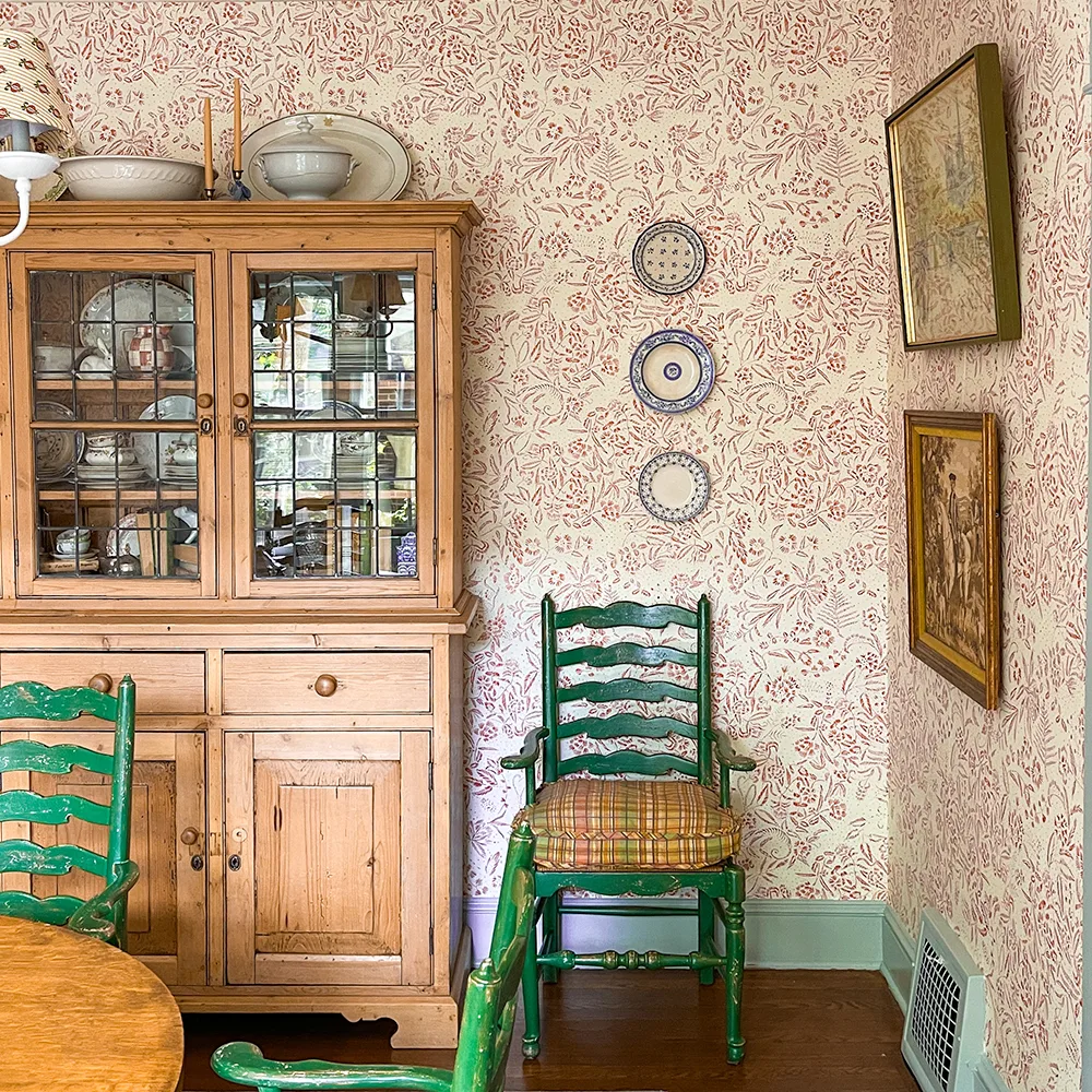 Dining room with red floral and cream wallpaper