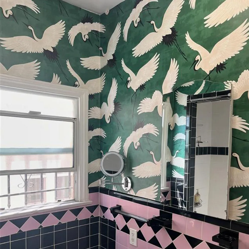 Bathroom with emerald crane wallpaper.