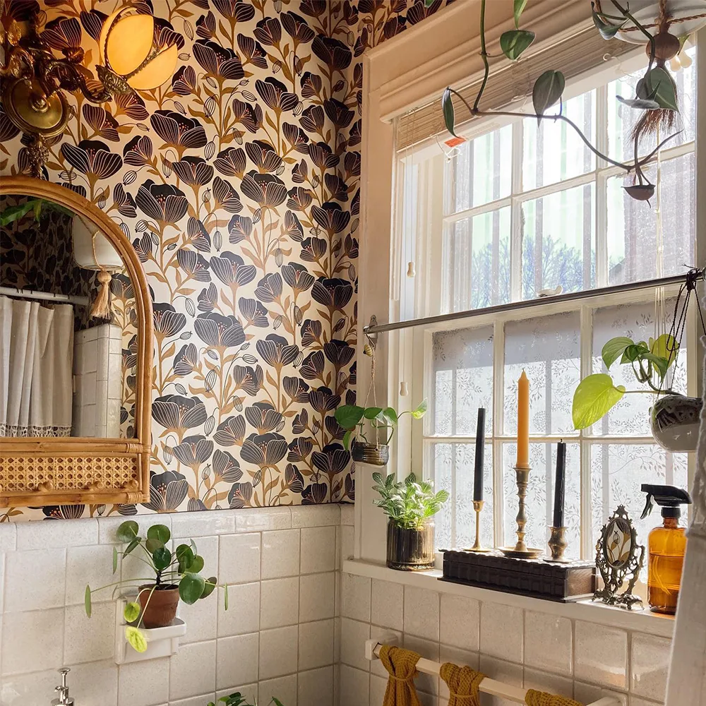 Black poppies wallpaper in a boho bathroom.