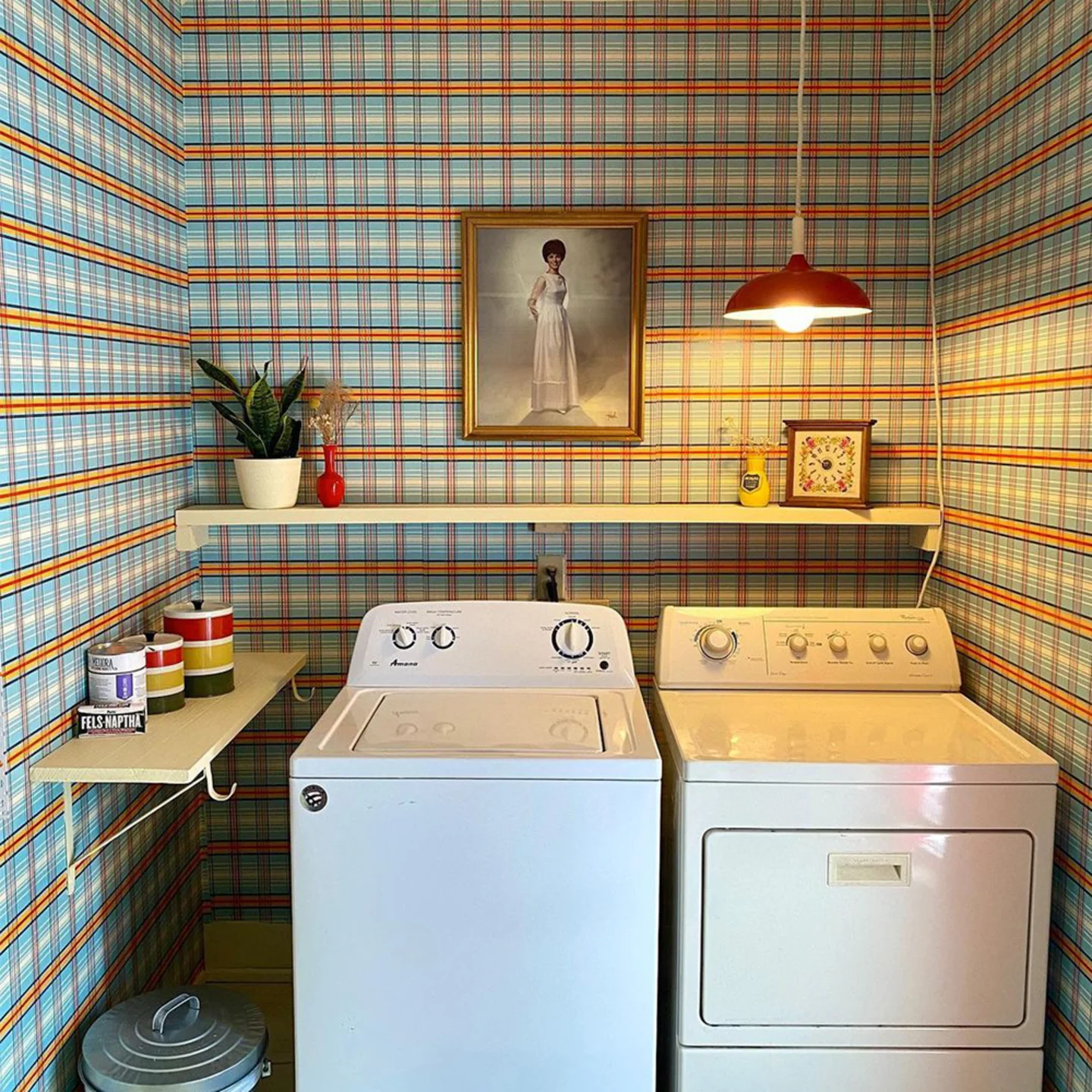 Laundry room with plaid wallpaper.