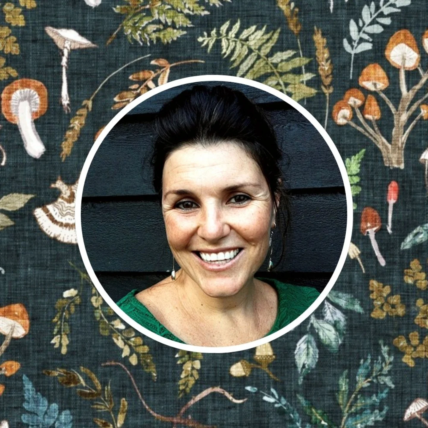 Headshot of Nouveau Bohemian behind her designed prints.