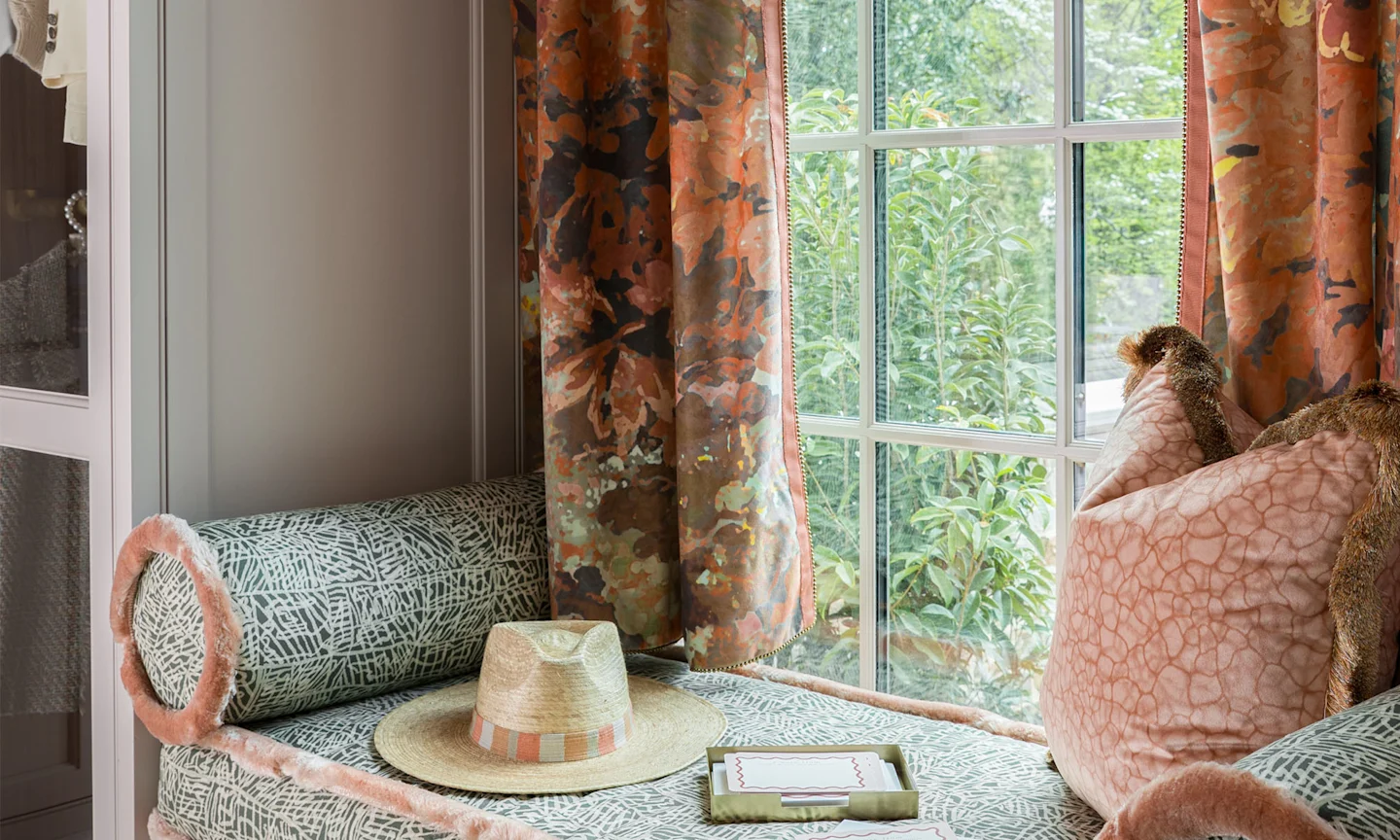 Window seat and curtains with fabric designed by Indigo Pruitt.