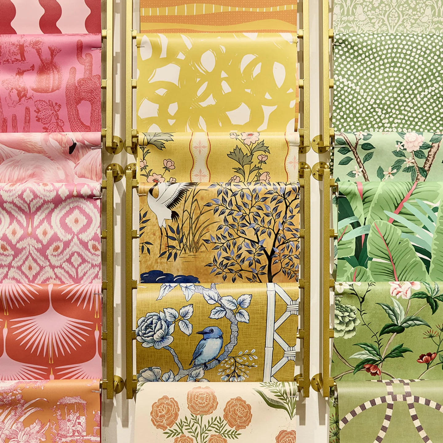 Person holding three throw pillows